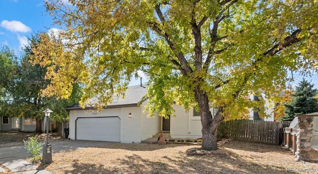 view of side of property with a garage