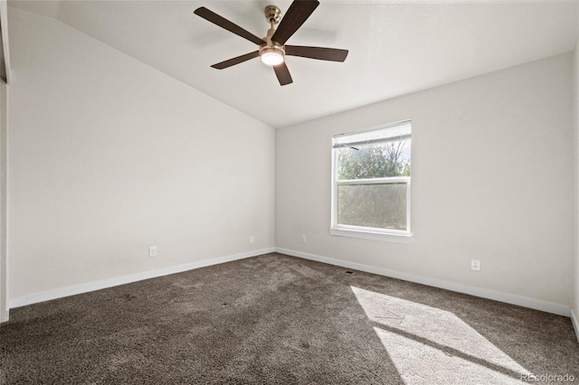 carpeted empty room with ceiling fan and lofted ceiling