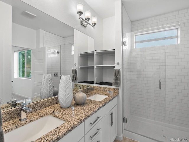 11719 W 45th Pl, Wheat Ridge, CO 80033 - bathroom featuring double vanity, healthy amount of natural light, and a stall shower