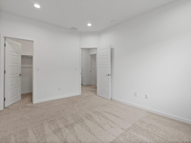 11719 W 45th Pl, Wheat Ridge, CO 80033 - unfurnished bedroom featuring carpet, baseboards, recessed lighting, and a walk in closet