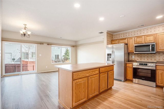 kitchen with visible vents, appliances with stainless steel finishes, and light wood finished floors