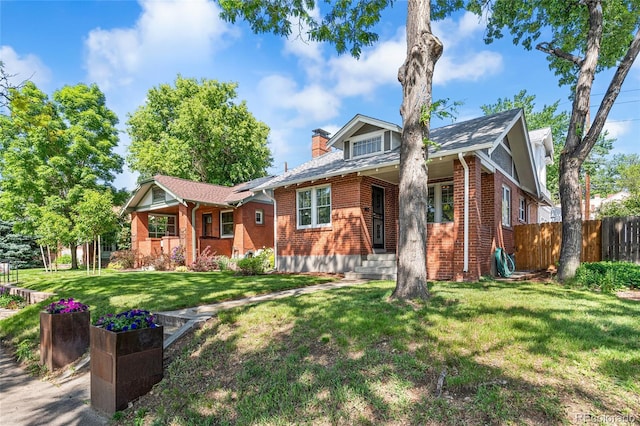 1260 S Emerson St, Denver, CO 80210 - view of front of property featuring brick siding and a chimney
