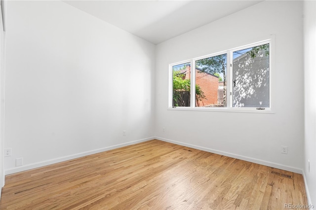 1260 S Emerson St, Denver, CO 80210 - unfurnished room with wood finished floors and baseboards