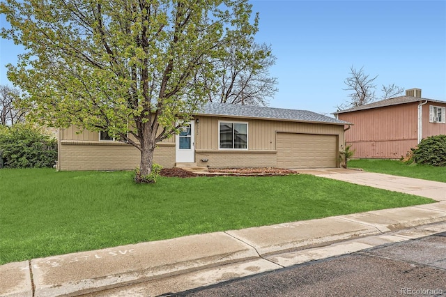 3512 E 117th Pl, Thornton, CO 80233 - view of front facade featuring brick siding, driveway, a garage, and a front lawn
