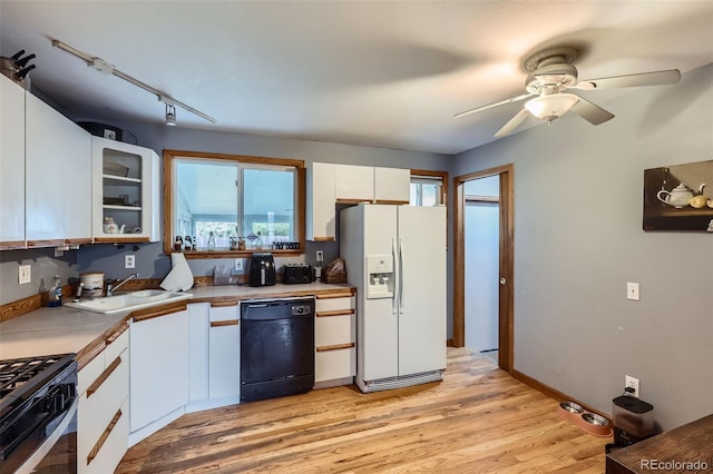 3512 E 117th Pl, Thornton, CO 80233 - kitchen featuring white fridge with ice dispenser, black dishwasher, a sink, white cabinetry, and light countertops