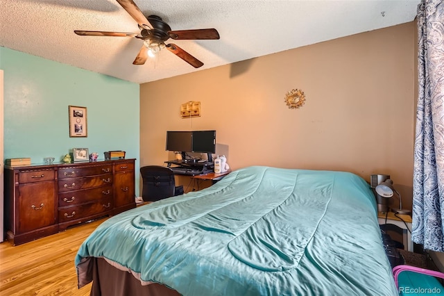 3512 E 117th Pl, Thornton, CO 80233 - bedroom featuring light wood-style floors, a ceiling fan, and a textured ceiling
