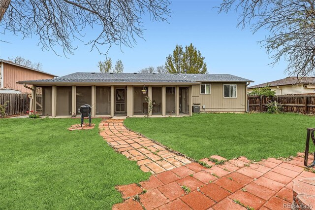 3512 E 117th Pl, Thornton, CO 80233 - rear view of property featuring central AC, a patio, and a sunroom