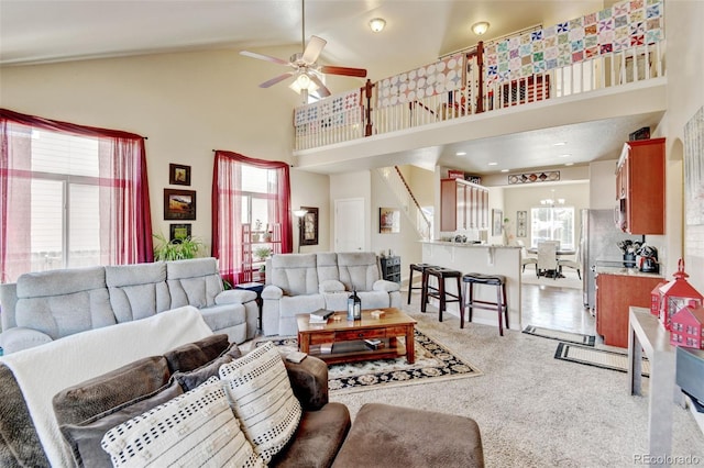 9046 Sandpiper Dr, Frederick, CO 80504 - living area with a ceiling fan, light carpet, and high vaulted ceiling