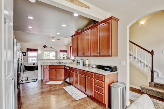 9046 Sandpiper Dr, Frederick, CO 80504 - kitchen featuring appliances with stainless steel finishes, ceiling fan, a sink, light wood-type flooring, and recessed lighting