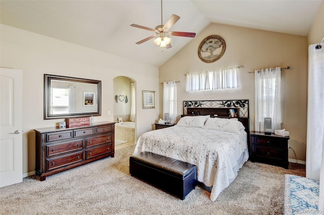 9046 Sandpiper Dr, Frederick, CO 80504 - bedroom with arched walkways, multiple windows, carpet, high vaulted ceiling, and ensuite bathroom