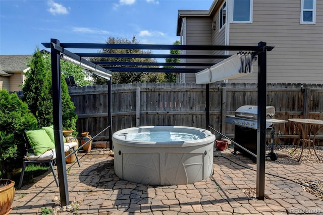 9046 Sandpiper Dr, Frederick, CO 80504 - view of patio featuring a hot tub, a pergola, and grilling area