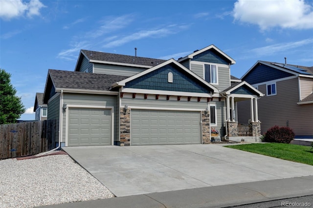 9046 Sandpiper Dr, Frederick, CO 80504 - craftsman inspired home featuring a garage, stone siding, and driveway