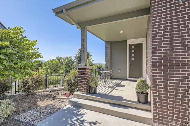 property entrance featuring a porch