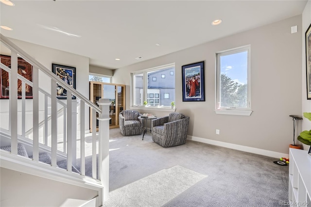 interior space featuring a healthy amount of sunlight and carpet floors