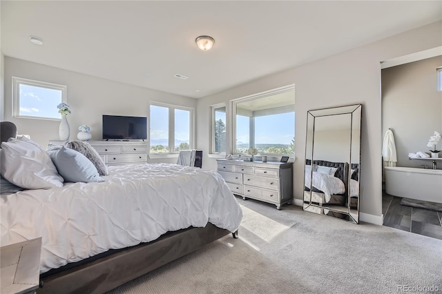 bedroom featuring light colored carpet