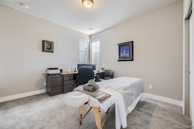 bedroom featuring light colored carpet