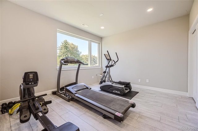 exercise room featuring light hardwood / wood-style flooring