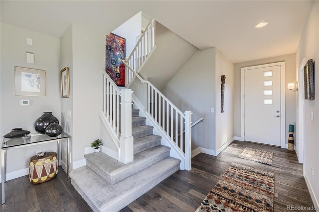 entrance foyer with dark hardwood / wood-style floors