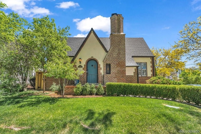 1300 Cherry St, Denver, CO 80220 - tudor house with stucco siding, roof with shingles, and brick siding
