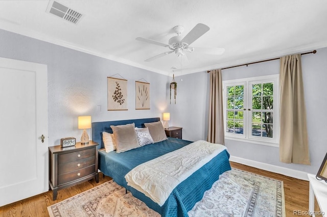 1300 Cherry St, Denver, CO 80220 - bedroom with wood finished floors, ornamental molding, ceiling fan, and baseboards