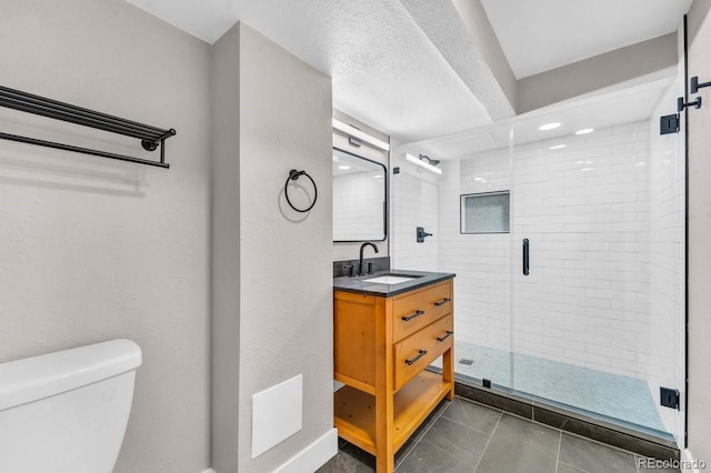 1300 Cherry St, Denver, CO 80220 - bathroom with vanity, toilet, a shower stall, and tile patterned floors