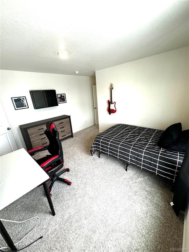 carpeted bedroom with a textured ceiling