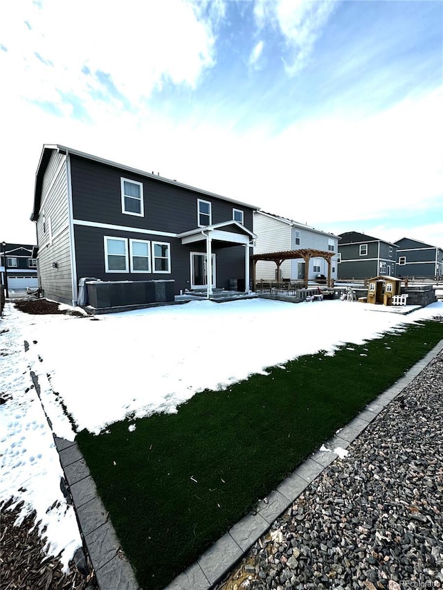 view of snow covered house