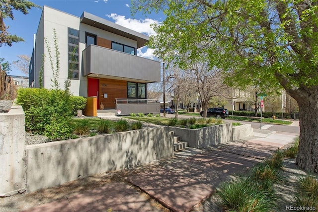 1801 W 33rd Ave, Denver, CO 80211 - view of front facade featuring a balcony and stucco siding
