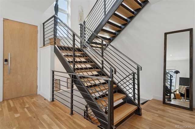 1801 W 33rd Ave, Denver, CO 80211 - stairway with wood finished floors and a high ceiling
