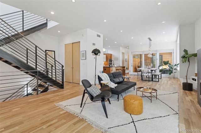 1801 W 33rd Ave, Denver, CO 80211 - living room with light wood-style floors, stairway, and recessed lighting