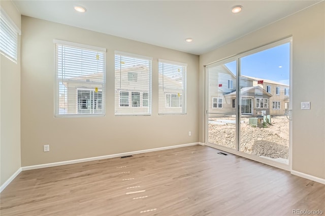 4114 Estrella St, Brighton, CO 80601 - empty room with light wood-style flooring and recessed lighting