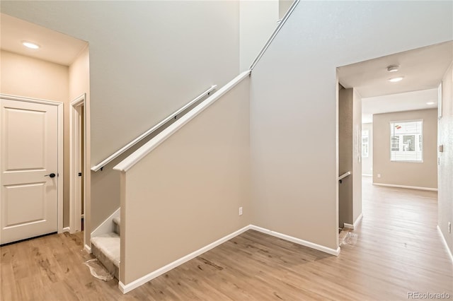 4114 Estrella St, Brighton, CO 80601 - stairway featuring wood finished floors and recessed lighting