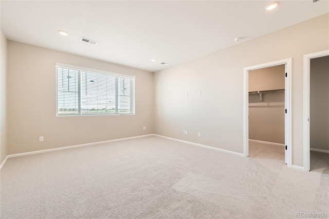 4114 Estrella St, Brighton, CO 80601 - unfurnished bedroom featuring a spacious closet, light colored carpet, and recessed lighting