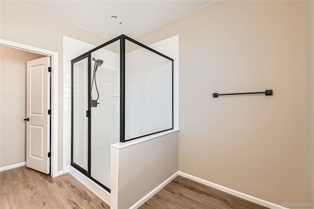 4114 Estrella St, Brighton, CO 80601 - full bath featuring wood finished floors and a shower stall