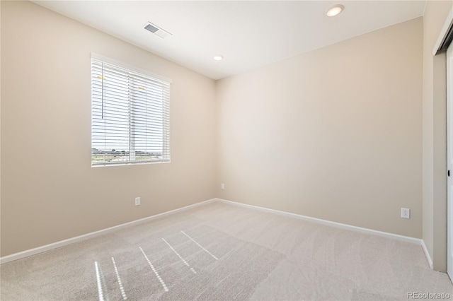 4114 Estrella St, Brighton, CO 80601 - empty room featuring light colored carpet and recessed lighting