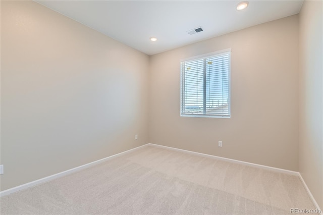 4114 Estrella St, Brighton, CO 80601 - empty room featuring light colored carpet and recessed lighting