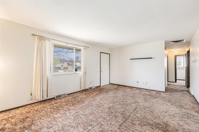 726 Mobile St, Aurora, CO 80011 - carpeted empty room with healthy amount of natural light