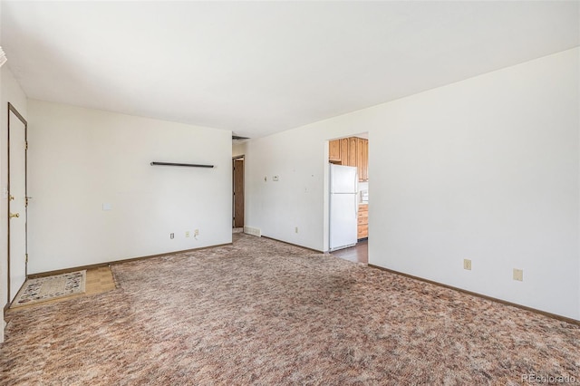 726 Mobile St, Aurora, CO 80011 - carpeted empty room with baseboards