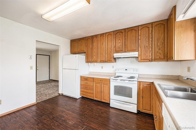 726 Mobile St, Aurora, CO 80011 - kitchen featuring white appliances, under cabinet range hood, a sink, dark wood-style flooring, and light countertops