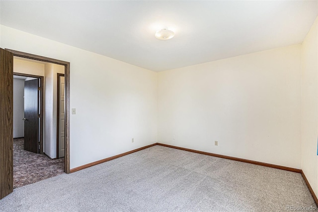726 Mobile St, Aurora, CO 80011 - carpeted empty room featuring baseboards