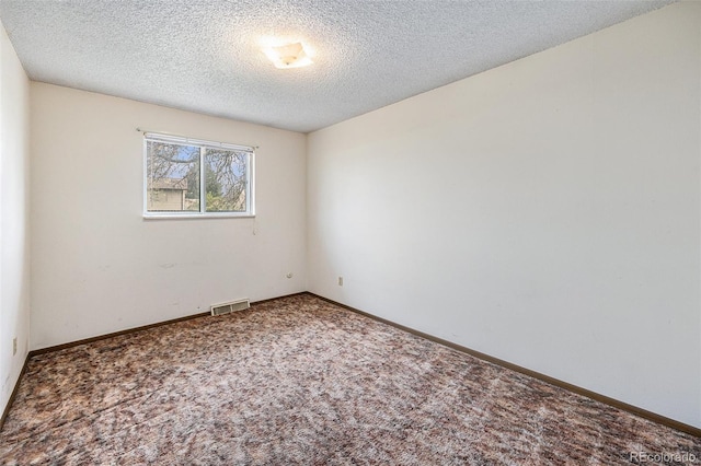 726 Mobile St, Aurora, CO 80011 - carpeted empty room with a textured ceiling