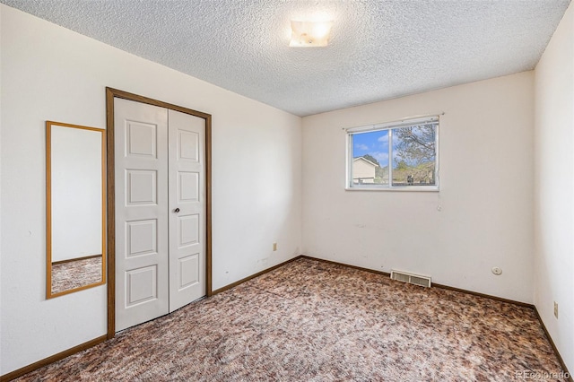 726 Mobile St, Aurora, CO 80011 - empty room with carpet, a textured ceiling, and baseboards