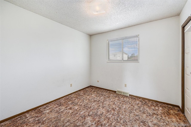 726 Mobile St, Aurora, CO 80011 - unfurnished bedroom featuring carpet, a textured ceiling, and baseboards