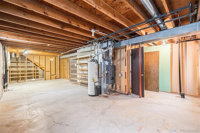 726 Mobile St, Aurora, CO 80011 - unfinished below grade area featuring gas water heater, stairs, and heating unit