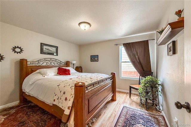 13642 Wrangler Way, Mead, CO 80542 - bedroom featuring baseboards and light wood finished floors