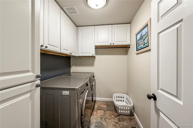 13642 Wrangler Way, Mead, CO 80542 - laundry room with independent washer and dryer, cabinet space, and dark stone finish floors