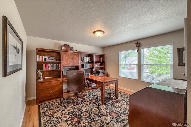 13642 Wrangler Way, Mead, CO 80542 - office with wood finished floors and a textured ceiling