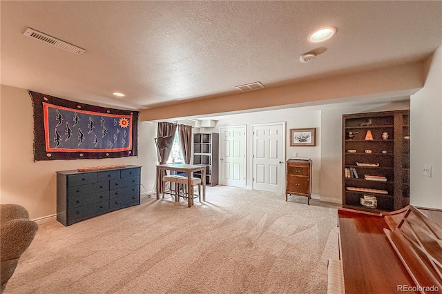 13642 Wrangler Way, Mead, CO 80542 - living area featuring carpet, a textured ceiling, and recessed lighting