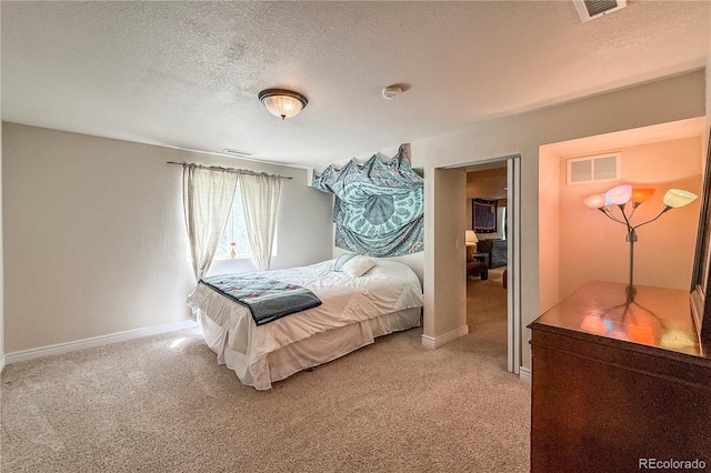 13642 Wrangler Way, Mead, CO 80542 - bedroom with light carpet and a textured ceiling