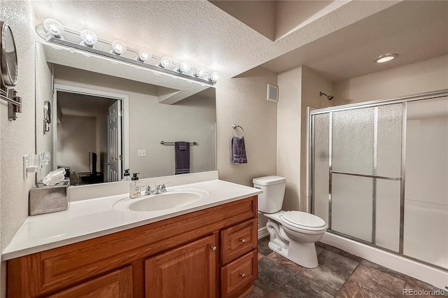 13642 Wrangler Way, Mead, CO 80542 - bathroom with a stall shower, vanity, and a textured ceiling